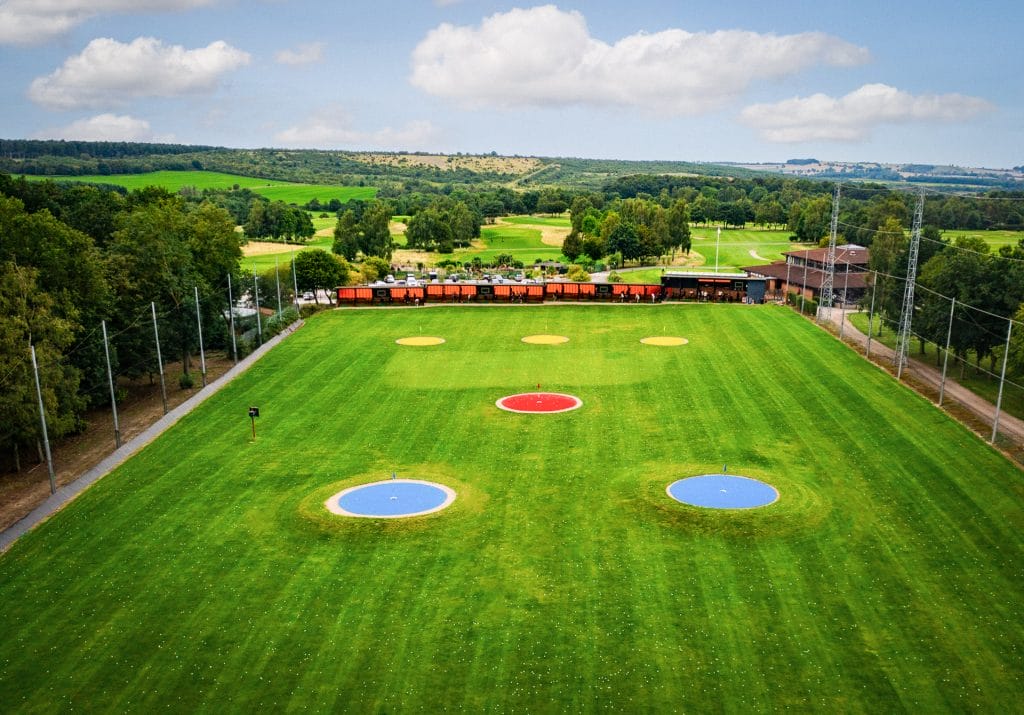 shot of the driving range in nottingham with targets and range bays
