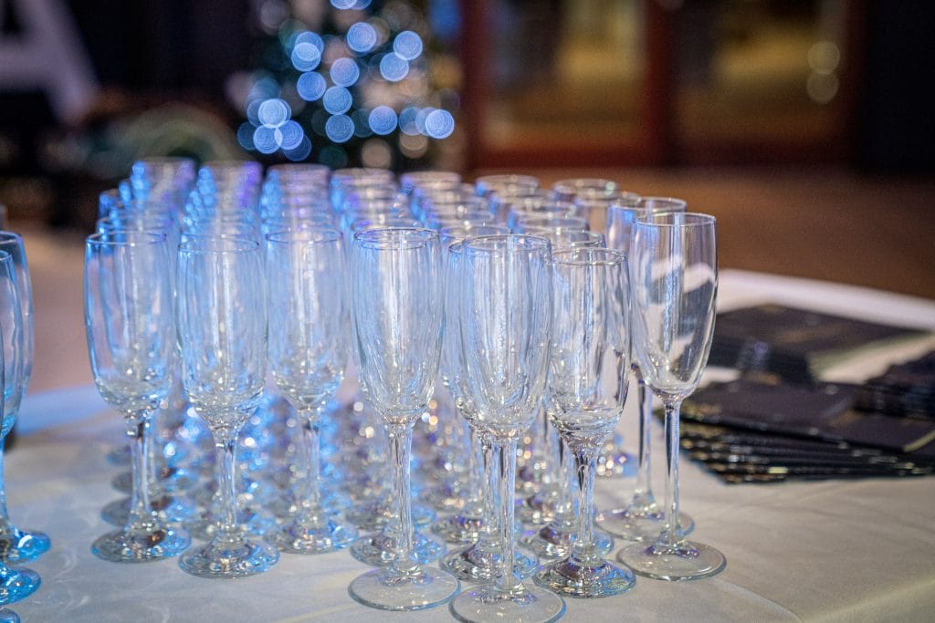 champagne flutes arranged on a table at a party venue in calverton