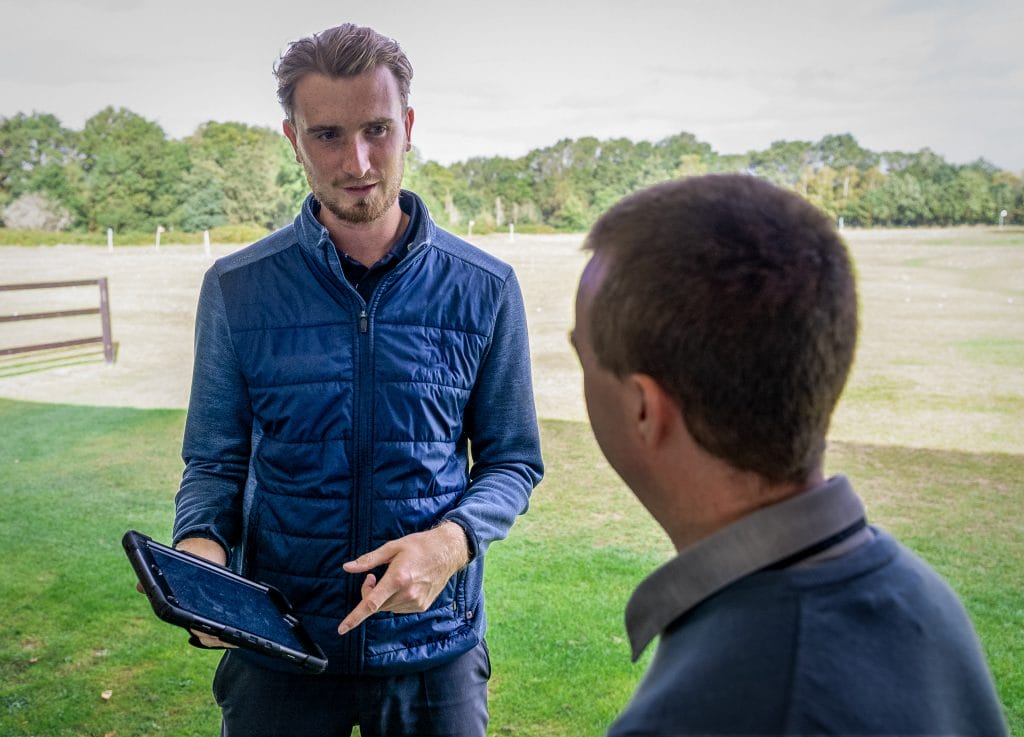 golf professional discussing tips during a golf lesson in nottingham