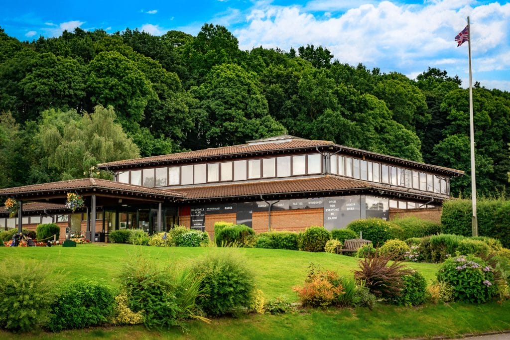 ramsdale park clubhouse surrounded by flowers and trees