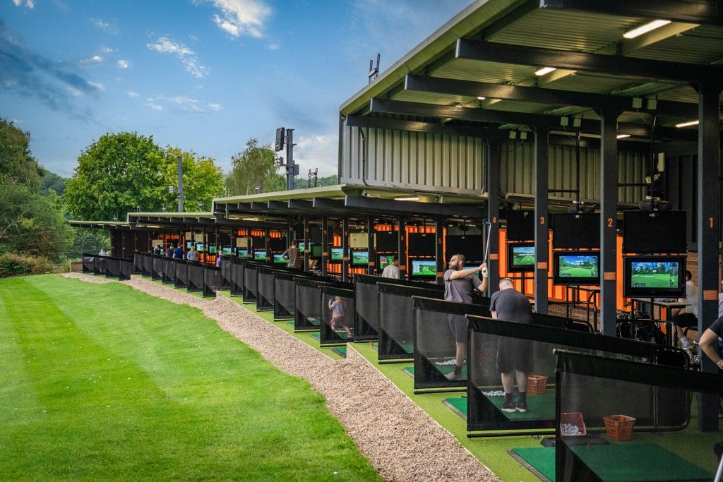 golfers hitting balls out of the trackman driving range in nottinghamshire