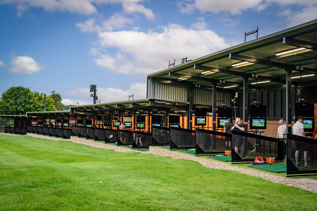 large driving range in nottingham showing golfers hitting balls at ramsdale