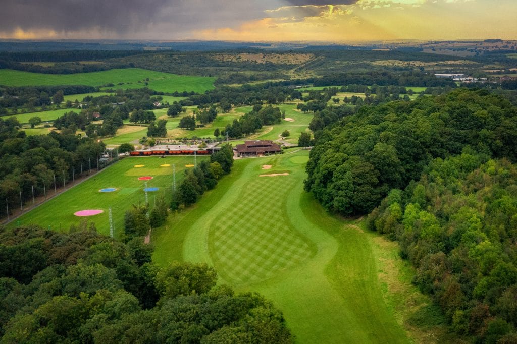 aerial shot showcasing the golf course and driving range in calverton at ramsdale park