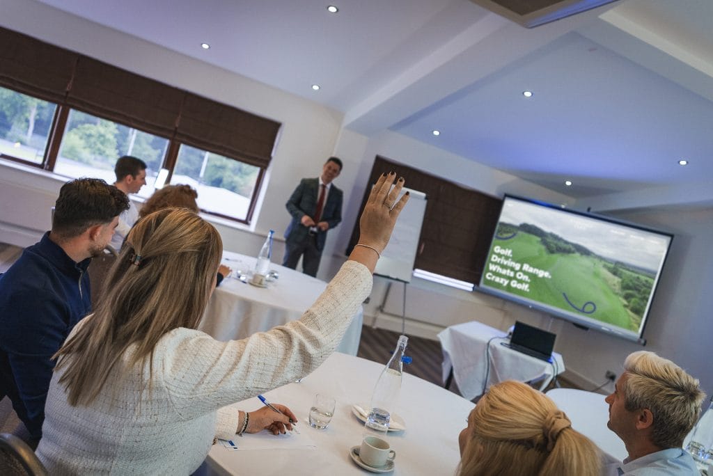 Hand being raised at a meeting venue in nottingham