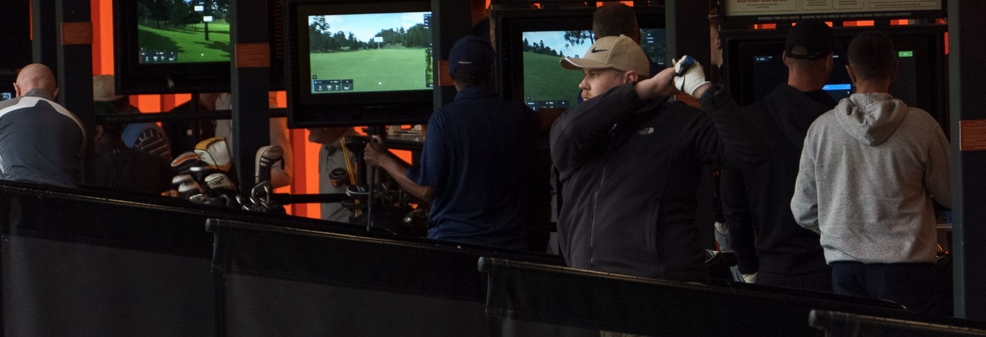 golfer watching ball flying out of driving range in nottingham