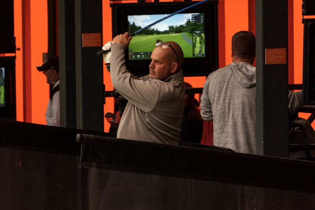 golfer hitting balls out of driving range near nottingham