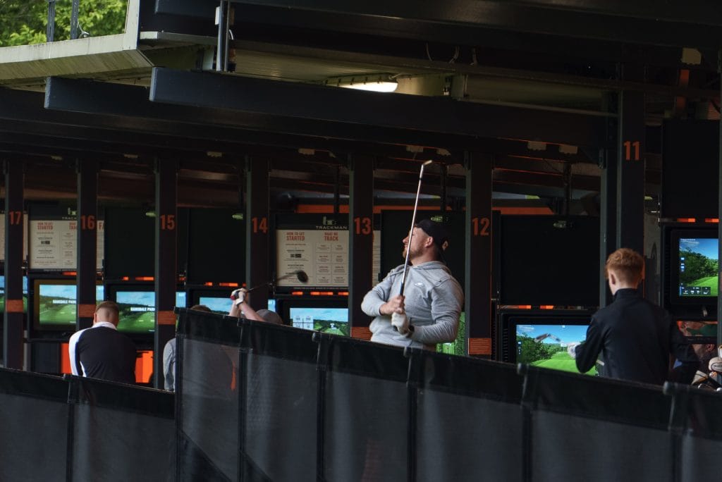 golfer watching shot out of driving range in nottingham