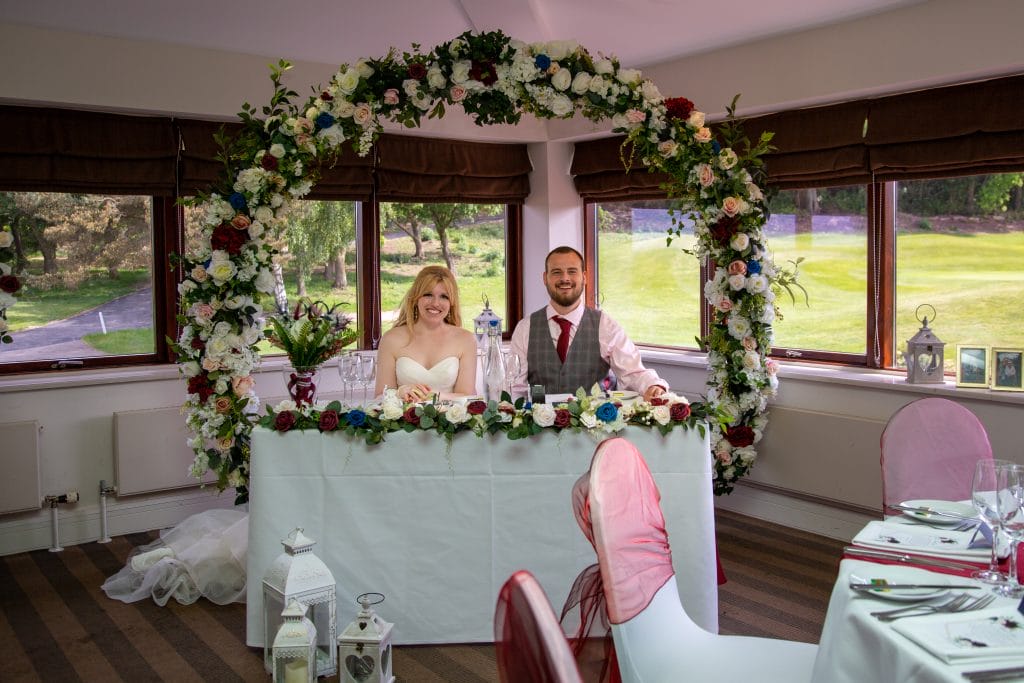 wedding couple sat at the top table at there wedding in nottingham